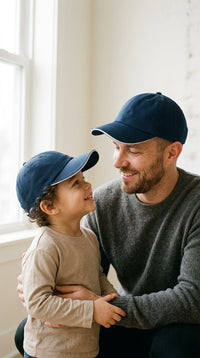 Navy — dad and child in matching navy Kindred Caps outdoors